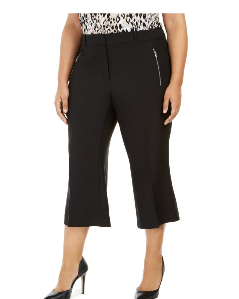 Front of a model wearing a size 16W Calvin Klein Women's Twill Double Zipper Cropped Pants Black 16W in Black by Calvin Klein. | dia_product_style_image_id:306338